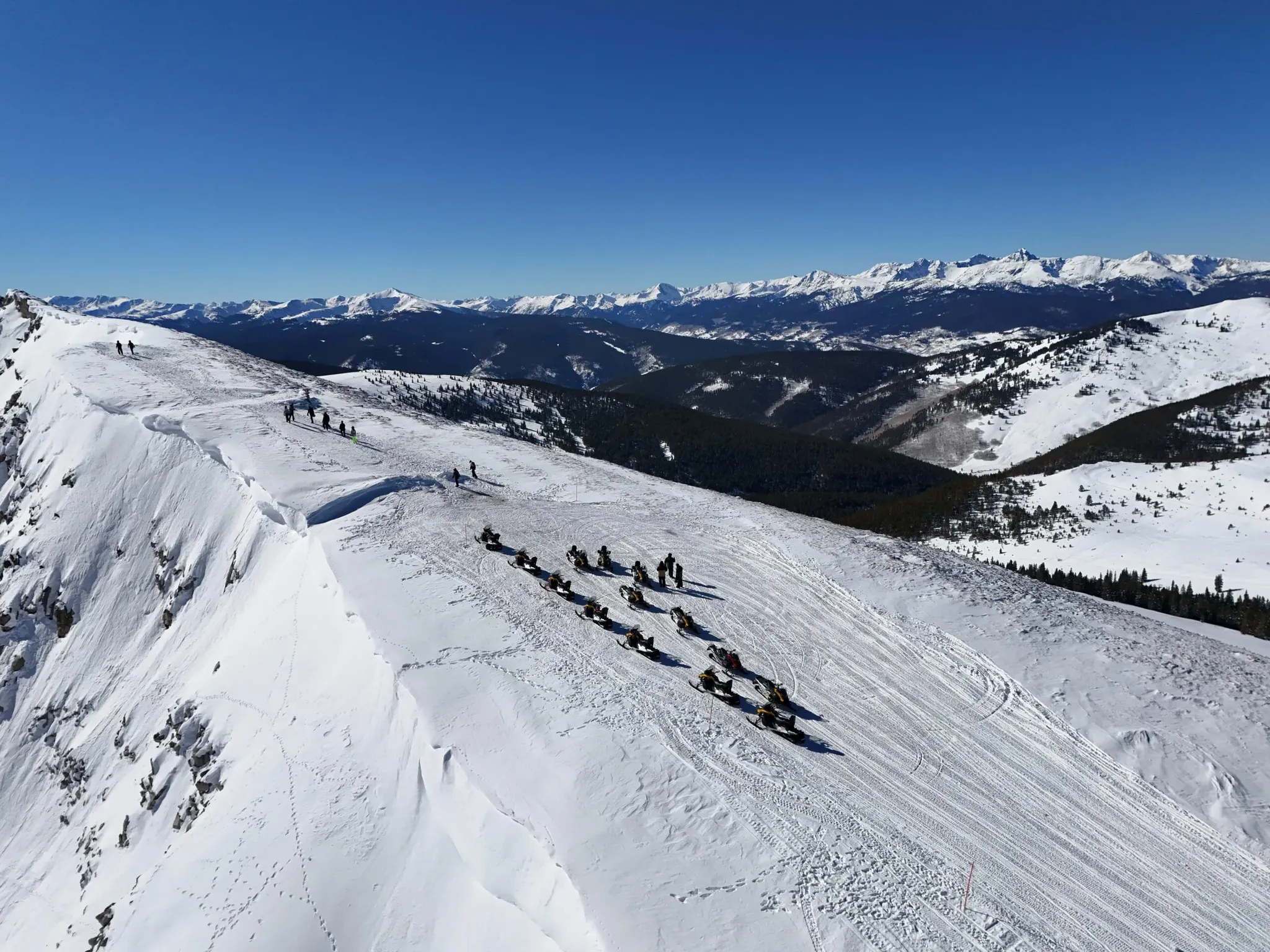 Snowmobile riders on a guided tour near Copper Mountain and Frisco, Colorado.